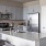 a kitchen with white cabinets