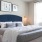 a bed with a blue headboard