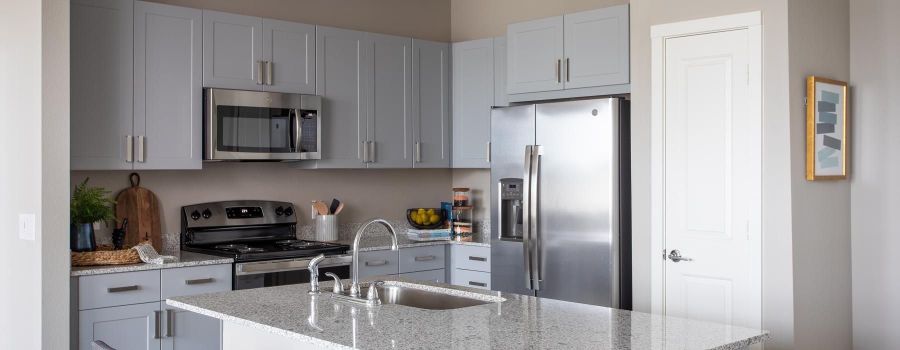 a kitchen with white cabinets