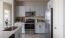 a kitchen with white cabinets