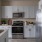 a kitchen with white cabinets
