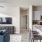 a kitchen with a couch and a tv