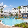 Resort-style swimming pool with lounge seating