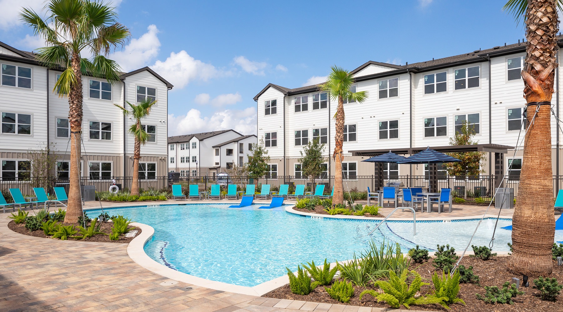 Resort-Style Pool Resort-style swimming pool with lounge seating